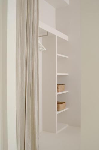 a curtain in front of a window with a mirror at Luxurious 1BR Apartment with Parking in Antwerp