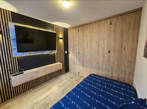 Ένα ή περισσότερα κρεβάτια σε δωμάτιο στο Apartamento Confort Norte Bogotá 170, Cerca Cardio Infantil, CTIC, Simon bolivar