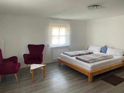 Un pat sau paturi într-o cameră la Ferienwohnungen Hackl Ulrike