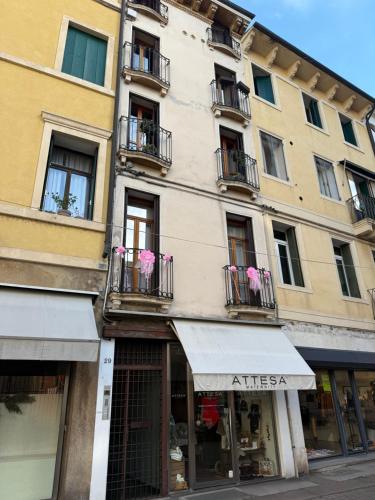 a building with windows and balconies on a street at casa duomo vicenza in Vicenza