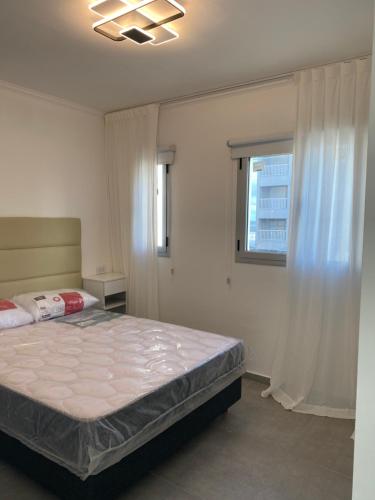 En eller flere senge i et værelse på J-H- DEPARTAMENTO