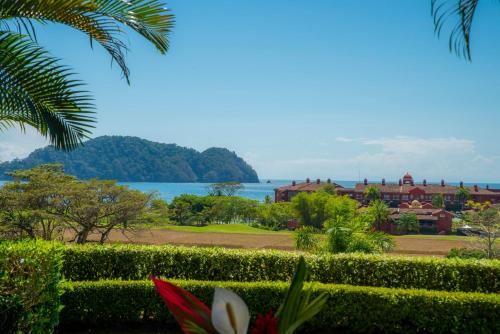 a view from the gardens of the resort at Vista Bahia 3F 1 bedr 1 1 and a half bath ocean view in La Mona