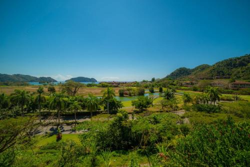 a view of a river in a field with trees at Vista Bahia 3F 1 bedr 1 1 and a half bath ocean view in La Mona