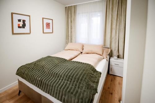 Postel nebo postele na pokoji v ubytování Apartamenty EUROPA