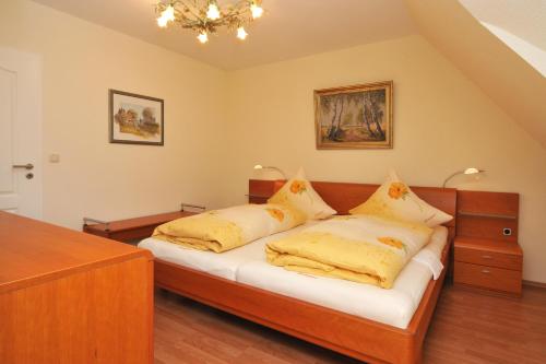 En eller flere senge i et værelse på -"Strandvilla - Vier Jahreszeiten" Doppelhaushälfte-