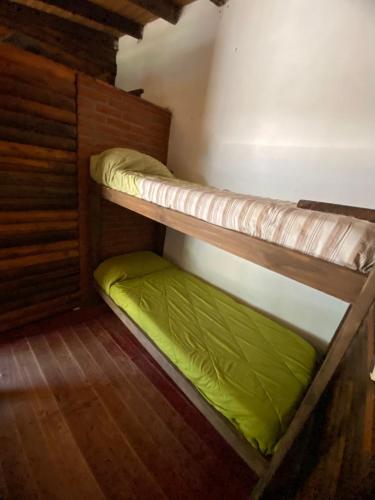 En eller flere senge i et værelse på Hospedaje Tiempo Azul