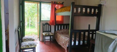 Ένα ή περισσότερα κρεβάτια σε δωμάτιο στο Alma Paisa, Guesthouse