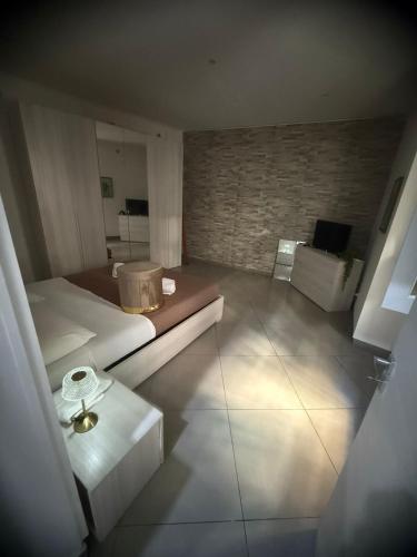 a view of a bedroom with a bed and a table at Garibaldi guest house in Catania