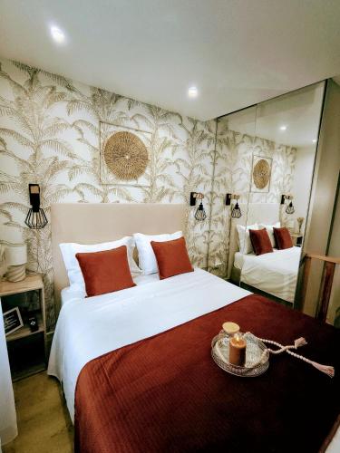 a hotel room with two beds and a mirror at Camarote Beach in Nazaré