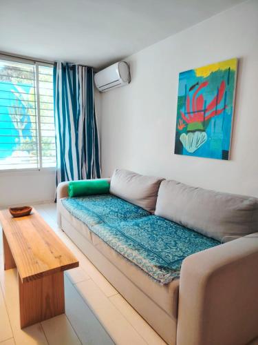 a living room with a couch and a table at Sidi Bou House in Sidi Bou Saïd