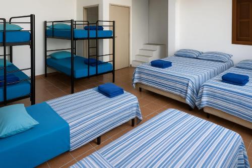 Ένα ή περισσότερα κρεβάτια σε δωμάτιο στο Pousada da Magia