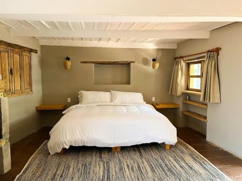 Ombligo connection houseにあるベッド