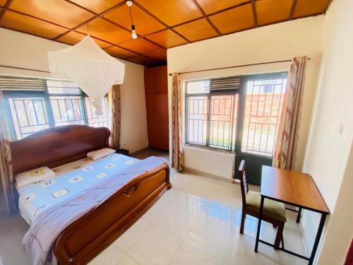 Ένα ή περισσότερα κρεβάτια σε δωμάτιο στο Beautiful spacious entire 4 bedrooms comfy house in Kimihurura