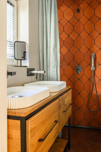 a bathroom with a sink and a shower at Boogas House - Gdańsk in Gdańsk