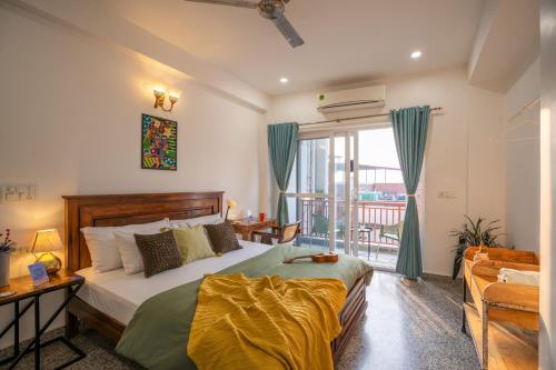 a bedroom with a bed and a large window at LiveAway Rishikesh, Laxman Jhula by PACK in Rishīkesh