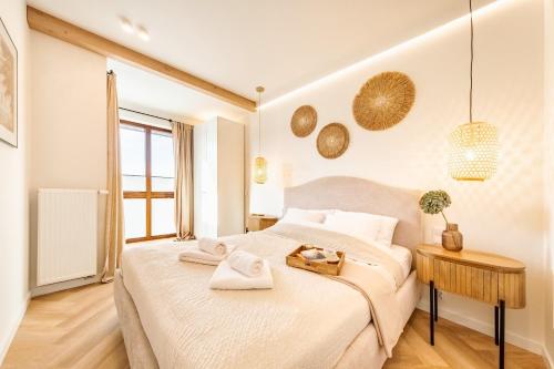 Ένα ή περισσότερα κρεβάτια σε δωμάτιο στο Wino&Grono Nałęczów