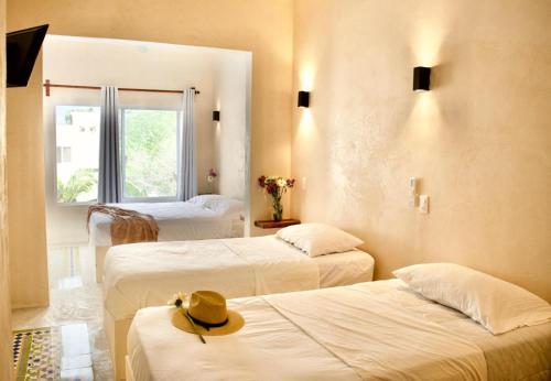 Postel nebo postele na pokoji v ubytování Chulel Hotel Origen