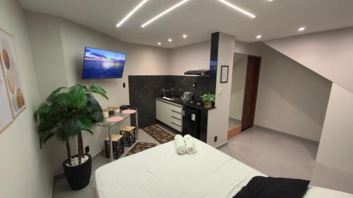 Η κουζίνα ή μικρή κουζίνα στο Flats do Cabo e Suítes