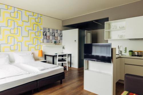 Η κουζίνα ή μικρή κουζίνα στο harry's home Dornbirn hotel & apartments