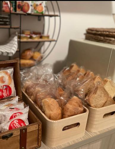 two trays of breads and pastries on a shelf at B&B Le due sorelle in Telese