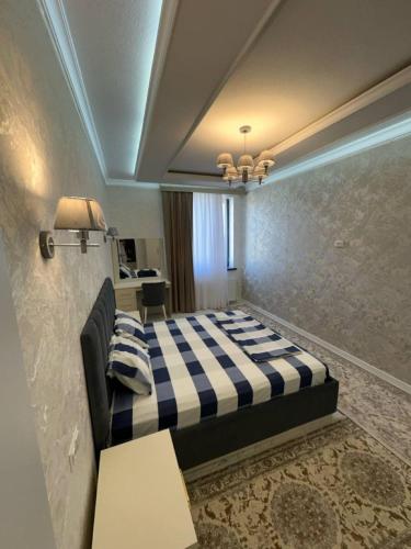 Ένα ή περισσότερα κρεβάτια σε δωμάτιο στο Mekhtarr Anbar Historical Hotel