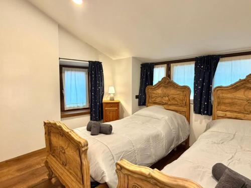 Giường trong phòng chung tại La Casa in Piazza - Edolo