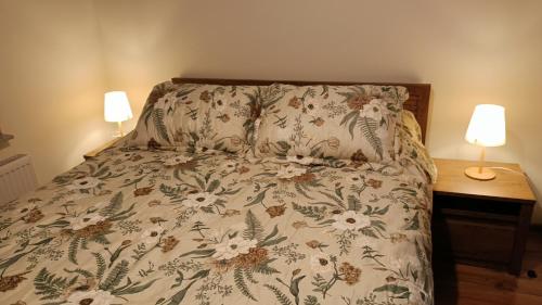 En eller flere senge i et værelse på Apartamenty Rudzka