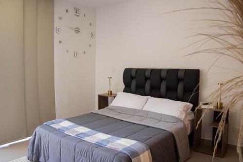 Кровать или кровати в номере Moderno apartamendo con Rooftop y Jacuzi