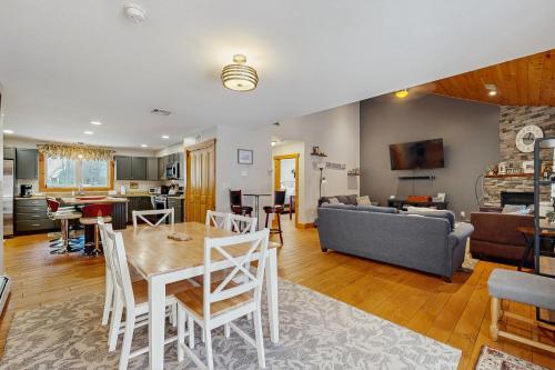 a kitchen and living room with a table and chairs at Bear Village 14 in Bartlett