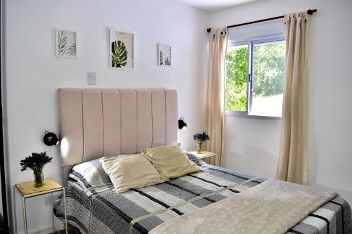 En eller flere senge i et værelse på Apart Altos de Ensueño