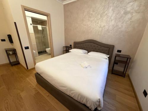 Ένα ή περισσότερα κρεβάτια σε δωμάτιο στο Le Stanze Del Duca