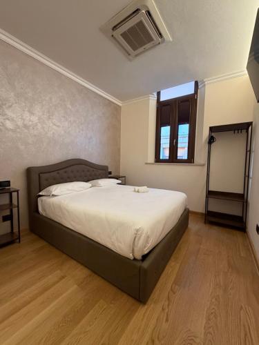 a bedroom with a large bed in a room at Le Stanze Del Duca in Ferrara