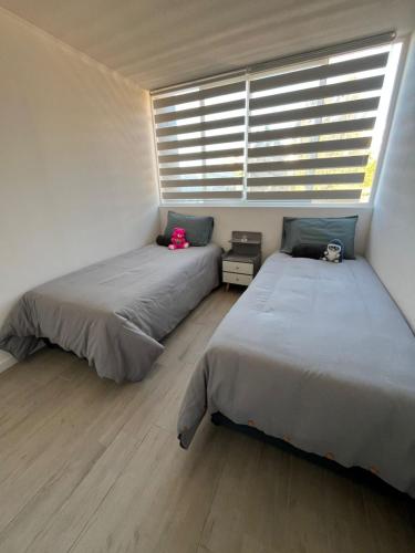 En eller flere senge i et værelse på Como en casa