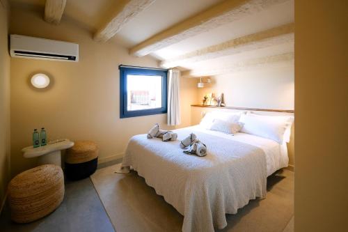 Ένα ή περισσότερα κρεβάτια σε δωμάτιο στο CaLagneta - Art i Vi