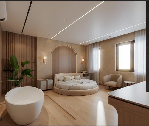 a bedroom with a bed and a chair and a table at Lam Anh Hotel 9 Him Lam Vạn Phúc in Hà Ðông