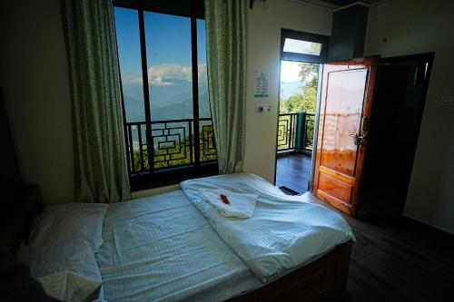 Ένα ή περισσότερα κρεβάτια σε δωμάτιο στο Golden View Homestay