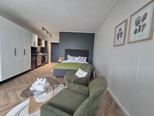 Postel nebo postele na pokoji v ubytování Trendy Studio Apartment in On Park