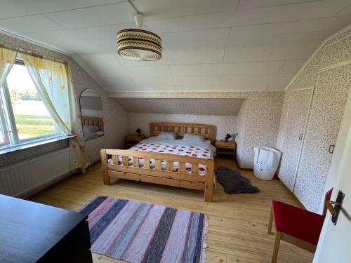 En eller flere senge i et værelse på Holiday home Hönstorp