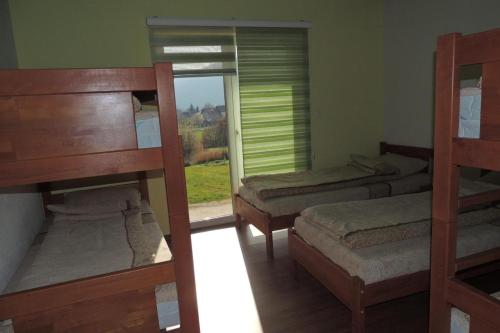 Ένα ή περισσότερα κρεβάτια σε δωμάτιο στο Hostel Sobe Popović