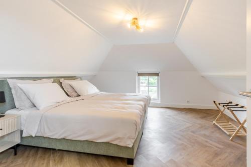 Ένα ή περισσότερα κρεβάτια σε δωμάτιο στο Duin en Daal