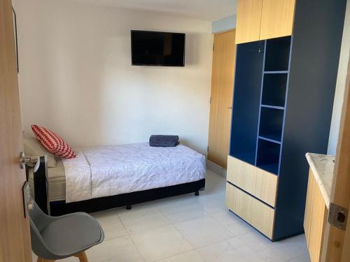 Ένα ή περισσότερα κρεβάτια σε δωμάτιο στο Living Alameda