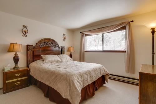 a bedroom with a large bed and a window at Winter Park Condo with Hot Tubs, 4 Mi to Ski Resort! in Winter Park