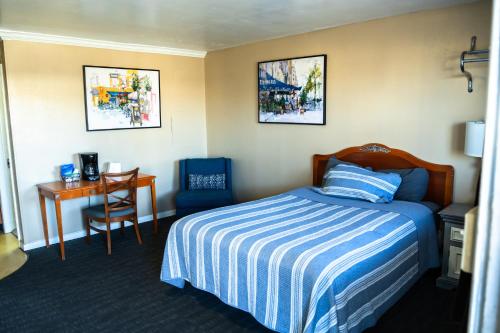 Ένα ή περισσότερα κρεβάτια σε δωμάτιο στο Yellowstone Motel