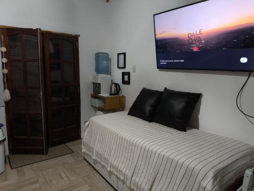 Ένα ή περισσότερα κρεβάτια σε δωμάτιο στο Las Carolas