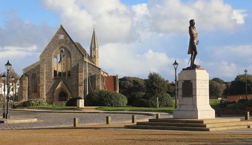 a statue of a man in front of a church at The Wellington Restaurant and Bar in Portsmouth