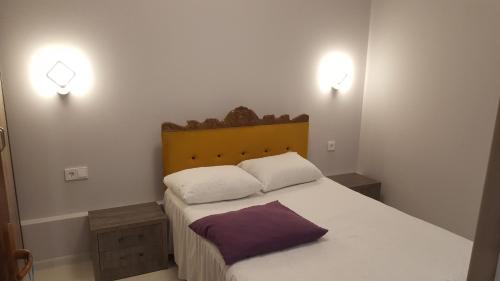 Ένα ή περισσότερα κρεβάτια σε δωμάτιο στο Уют 2