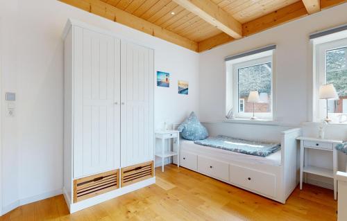 Ένα ή περισσότερα κρεβάτια σε δωμάτιο στο Tills Hüs