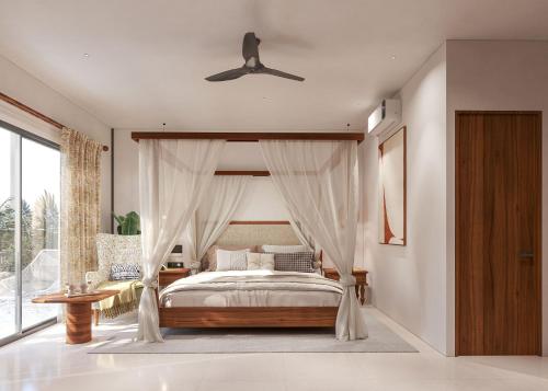 a bedroom with a canopy bed and a window at Aayovea Hotels & Resorts, Ayodhya in Ayodhya