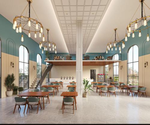a restaurant with tables and chairs in a cafeteria at Aayovea Hotels & Resorts, Ayodhya in Ayodhya