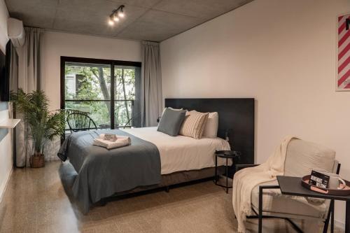 En eller flere senge i et værelse på Top Rentals Huergo 475